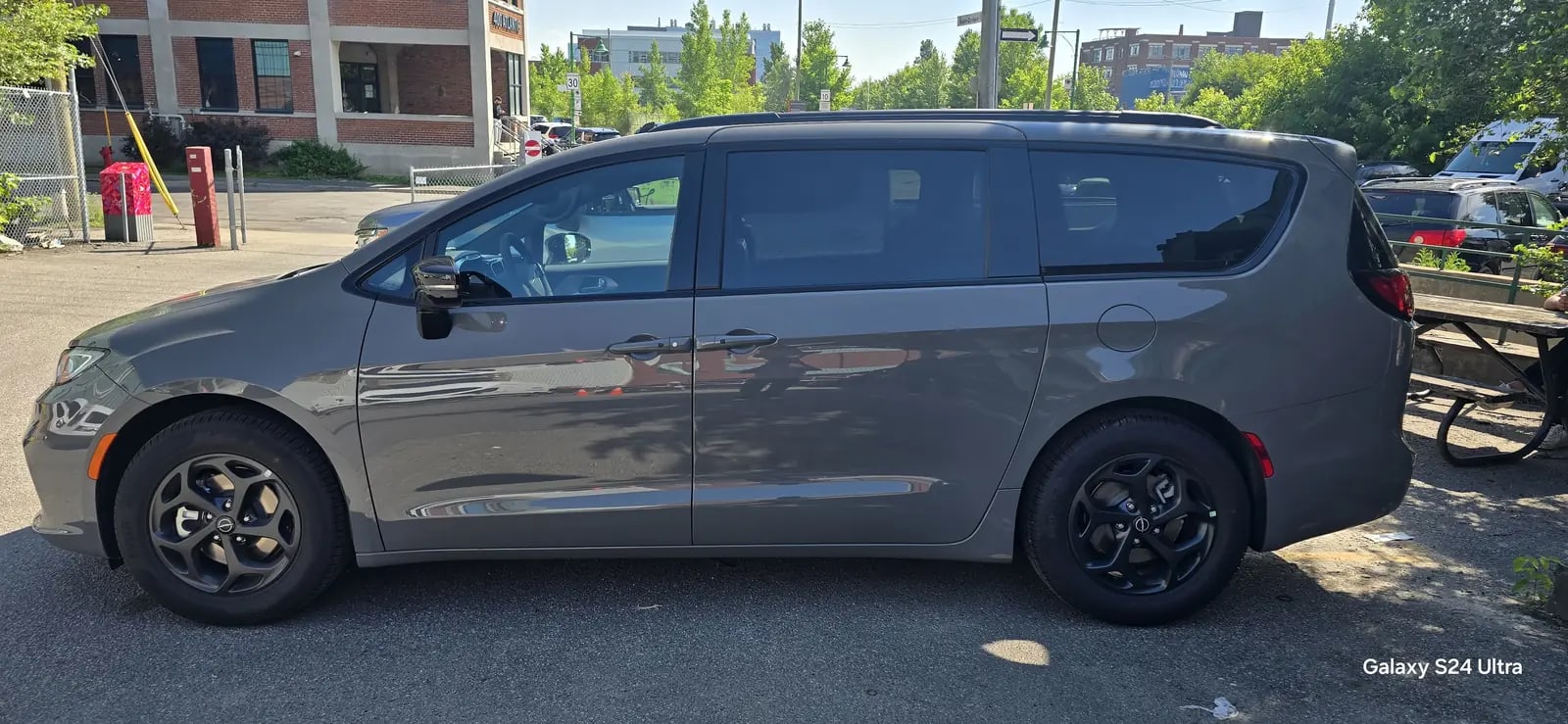 Grey minivan side profile with a clean exterior finish